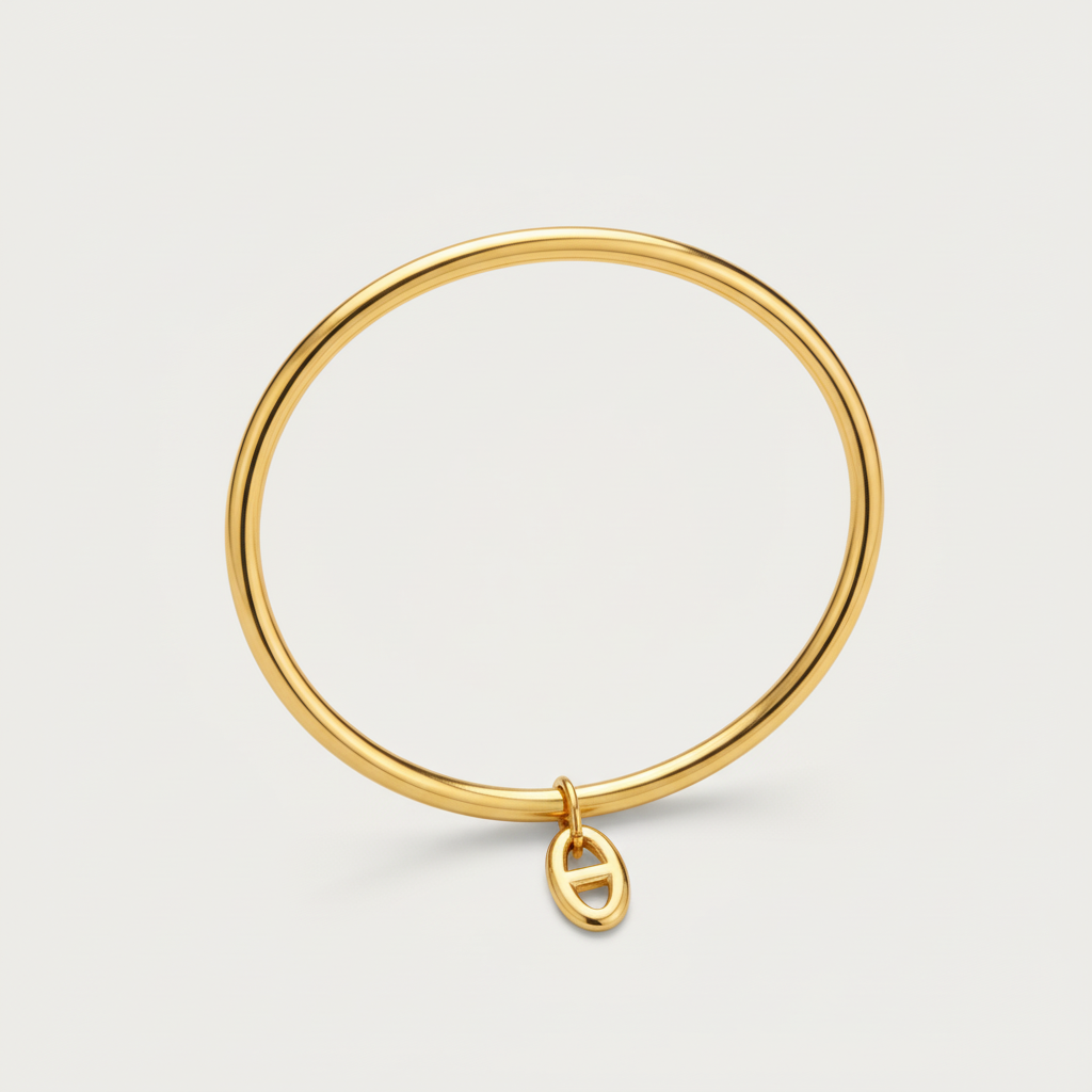 Bracelet Élégante pour femme en acier inoxydable doré, jonc double fin avec pendentif ovale, bijou waterproof Soreli Paris.